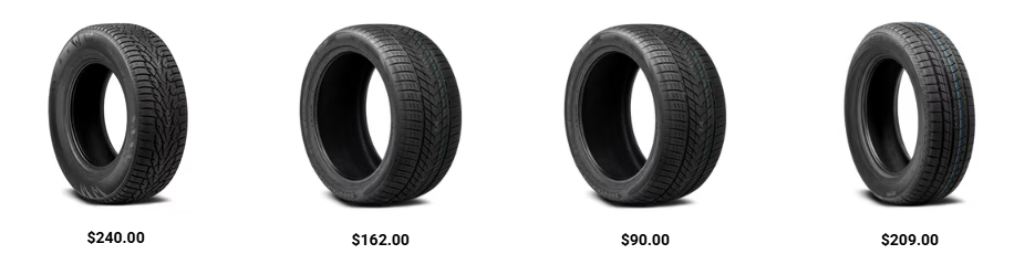 Mechanic installing winter tires on a car as temperatures drop before winter driving season.