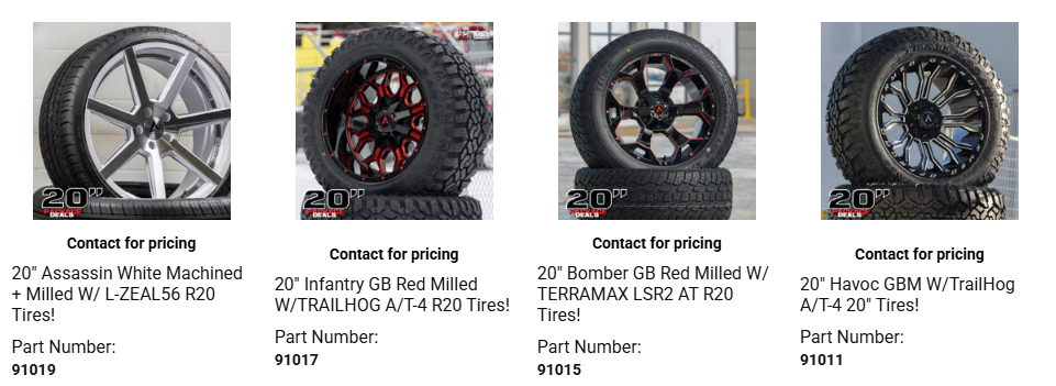 New tires stacked in auto shop with installation service included in total tire package price.