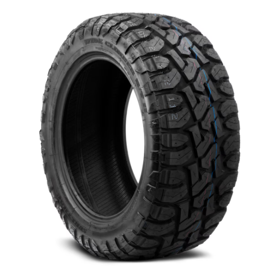 Pickup truck with larger tires installed showing a common tire upsizing modification.