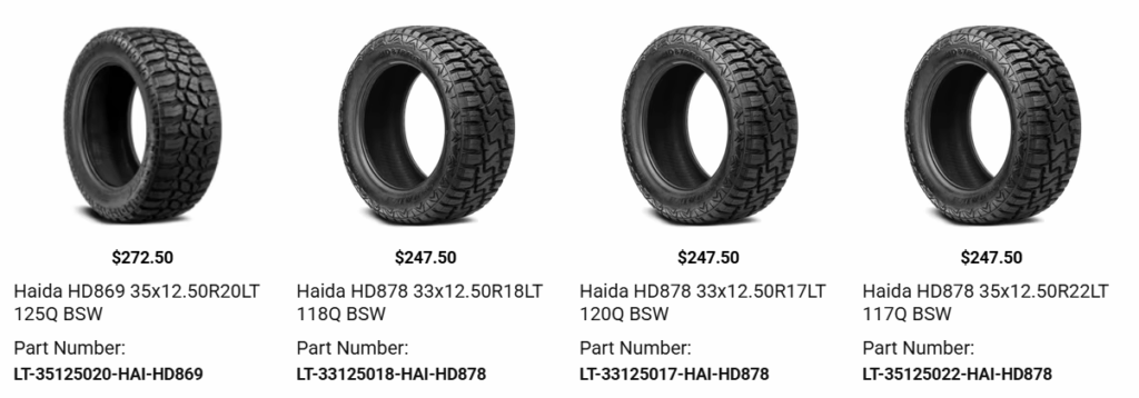 Pickup truck with reinforced tires designed for carrying heavy cargo and equipment.