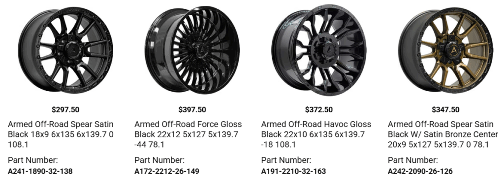 Pickup truck with upgraded wheels and tires showing proper fitment and wheel well clearance.